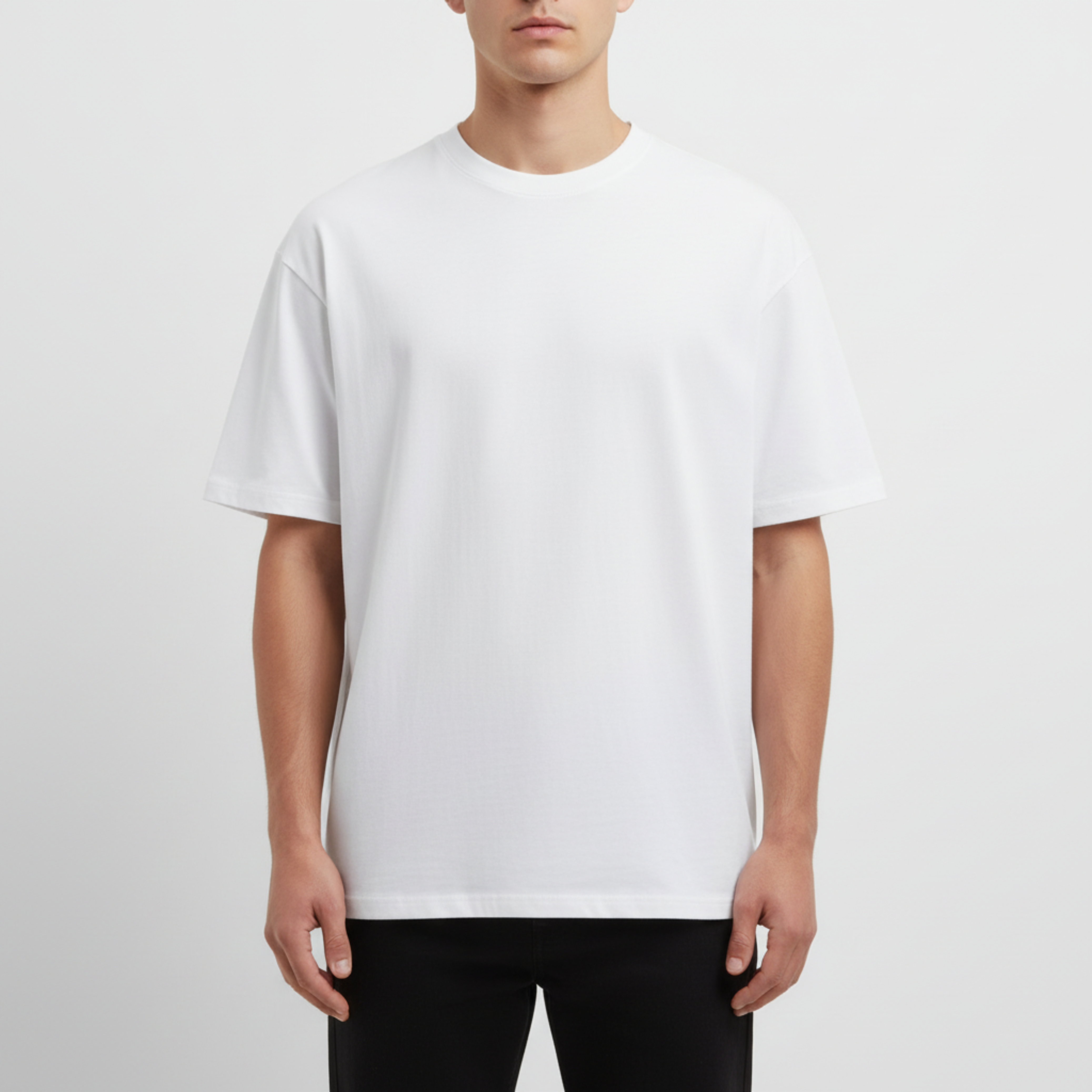 Person wearing a plain white t-shirt on a light gray background. Just Groom Me – Trimsalon Alphen aan den Rijn | Professional dog grooming & personalized pet apparel.