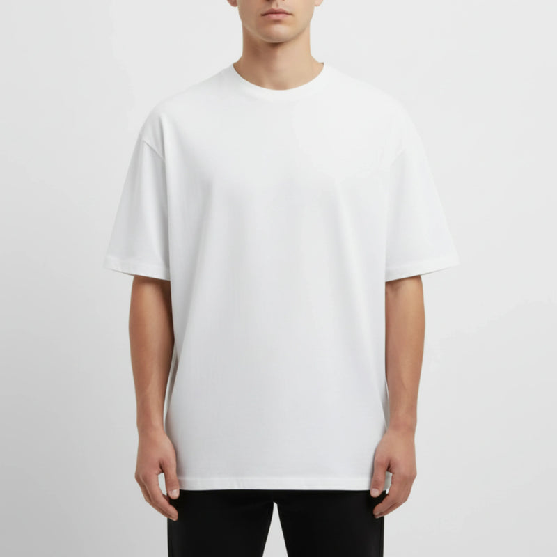 Person wearing a plain white t-shirt on a light gray background. Just Groom Me – Trimsalon Alphen aan den Rijn | Professional dog grooming & personalized pet apparel.