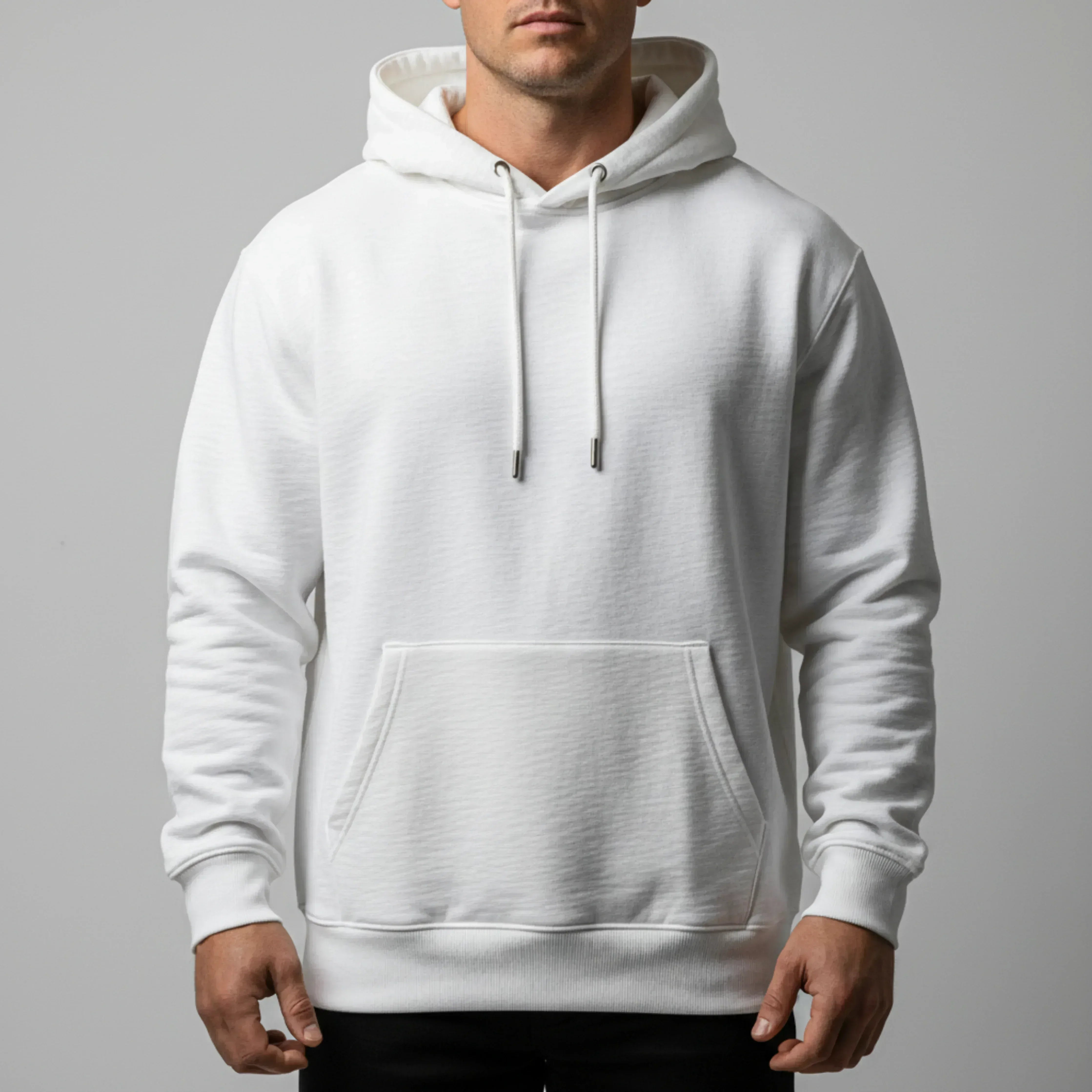 White hoodie worn by a person on a gray background. Just Groom Me – Trimsalon Alphen aan den Rijn | Professional dog grooming & personalized pet apparel.