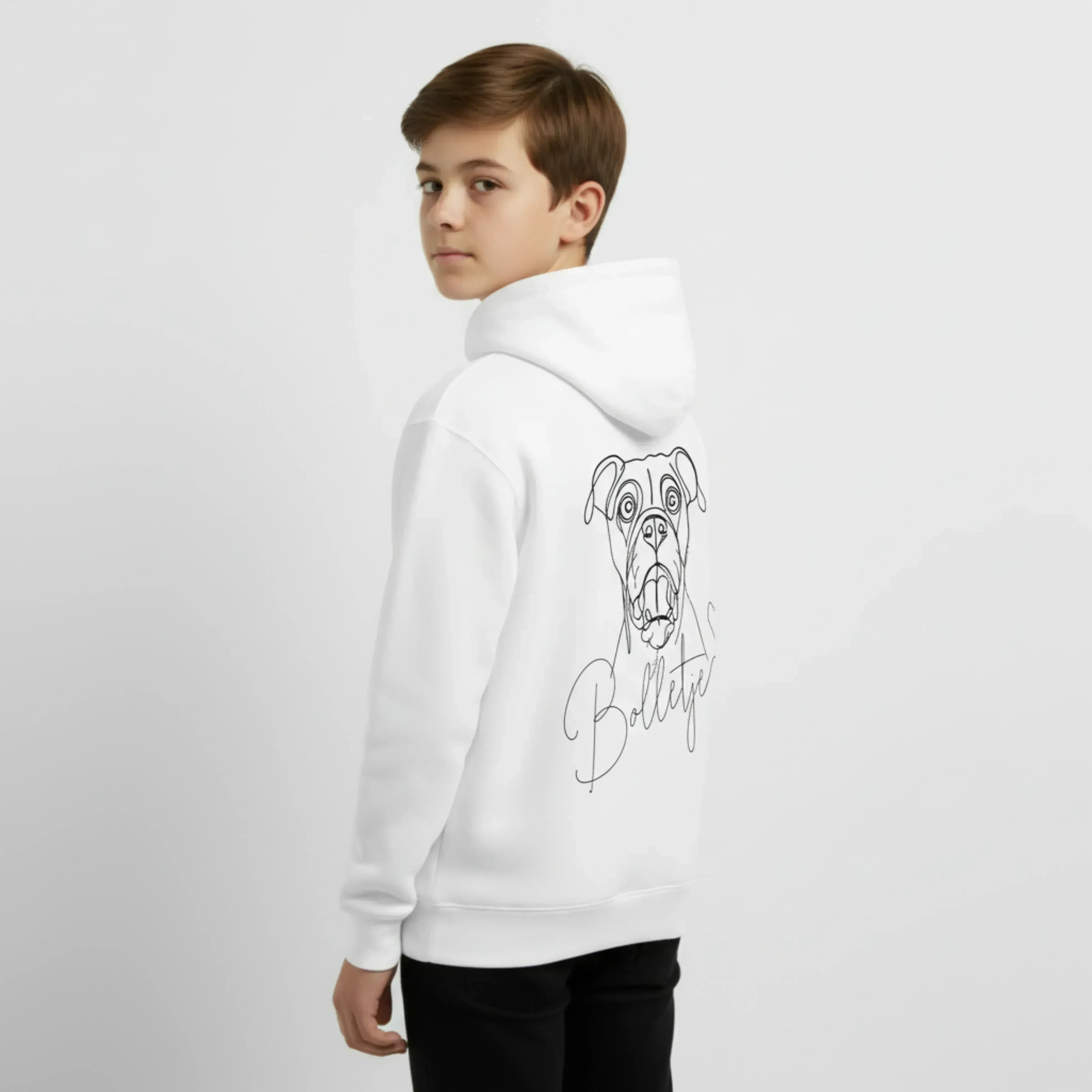 Person wearing a white hoodie with a dog graphic and 'Bulldog' text on the back, standing against a light gray background. Just Groom Me – Trimsalon Alphen aan den Rijn | Professional dog grooming & personalized pet apparel.