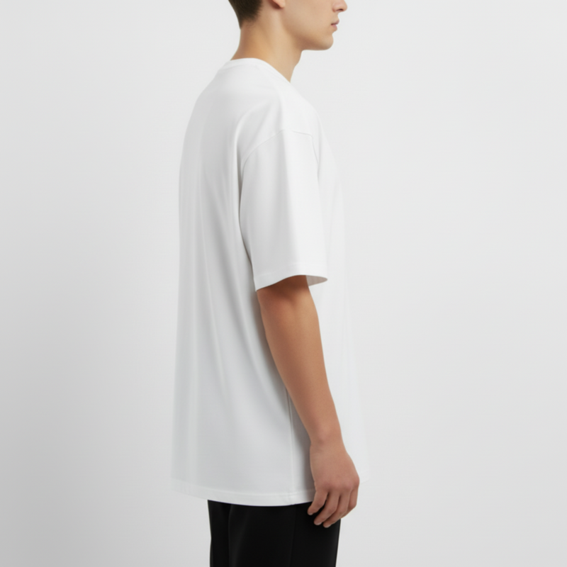 Person wearing a plain white t-shirt on a light gray background. Just Groom Me – Trimsalon Alphen aan den Rijn | Professional dog grooming & personalized pet apparel.