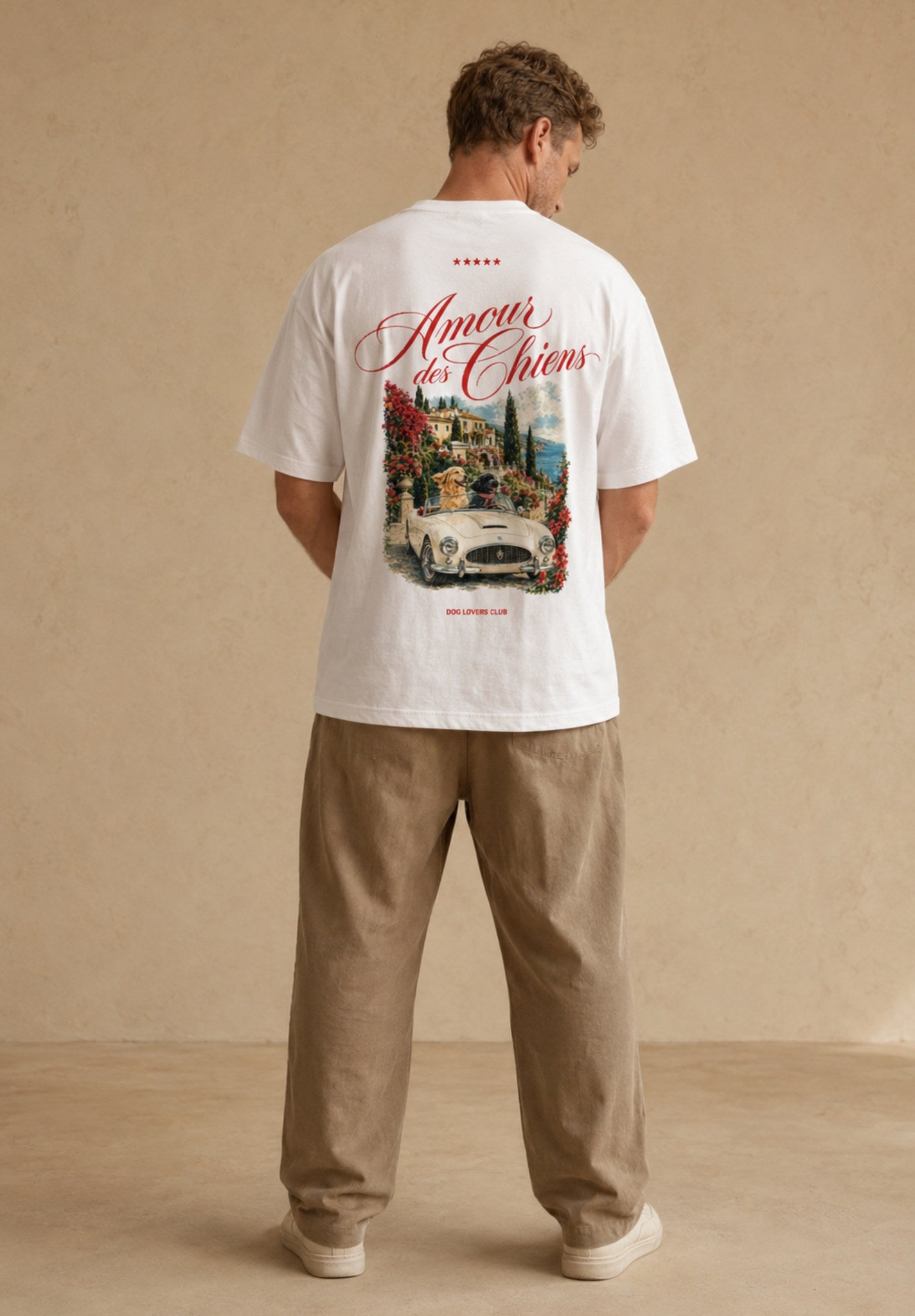 Man wearing Amour des Chiens oversized white t-shirt, back view