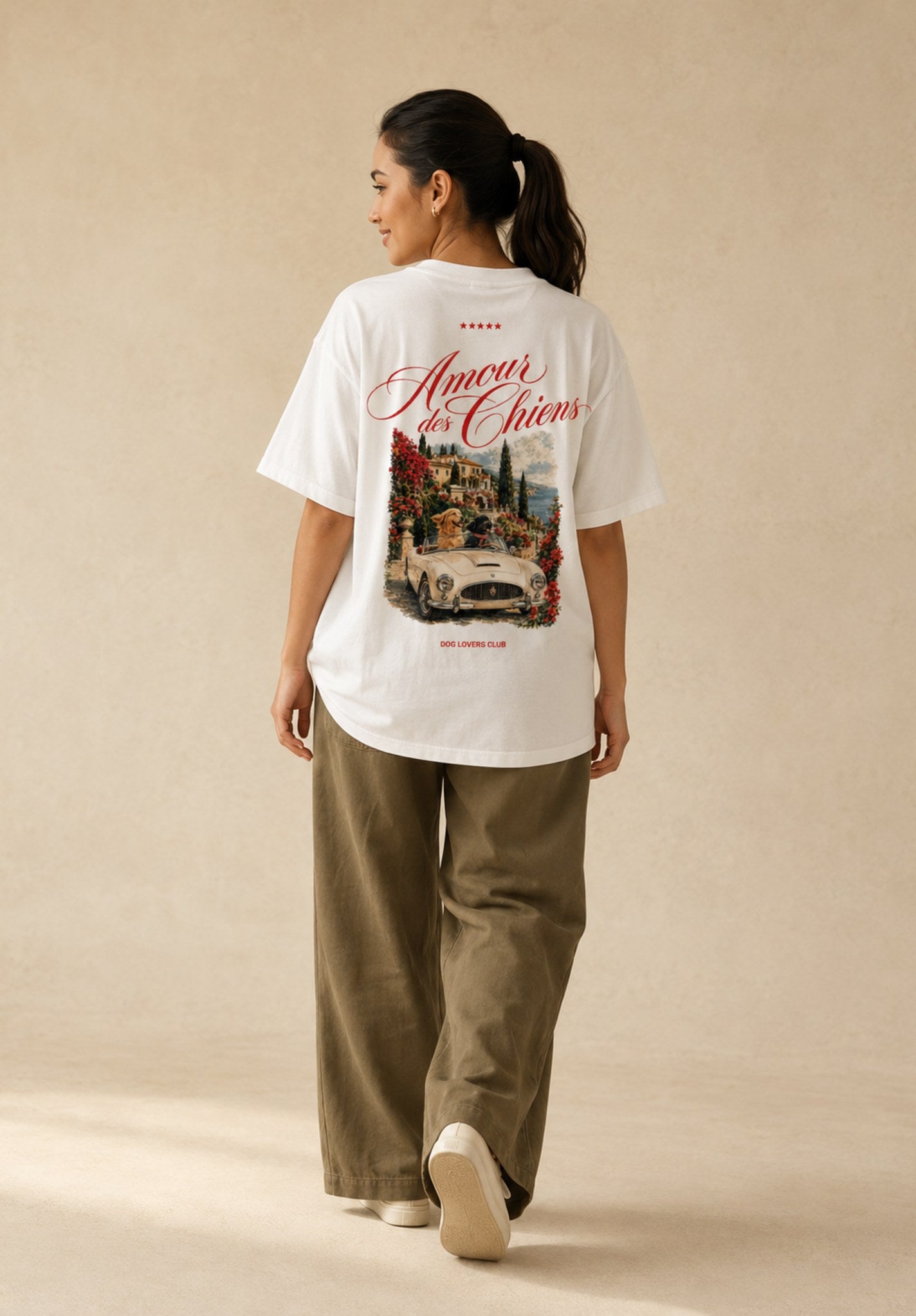 Woman wearing Amour des Chiens oversized white t-shirt, back view