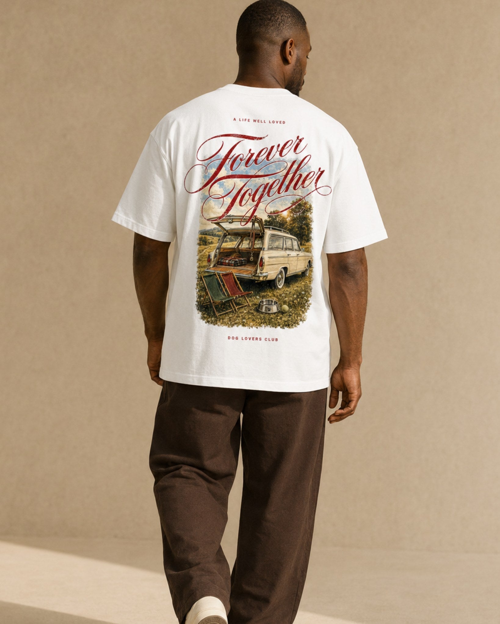 Man wearing Forever Together white oversized t-shirt, walking, back view