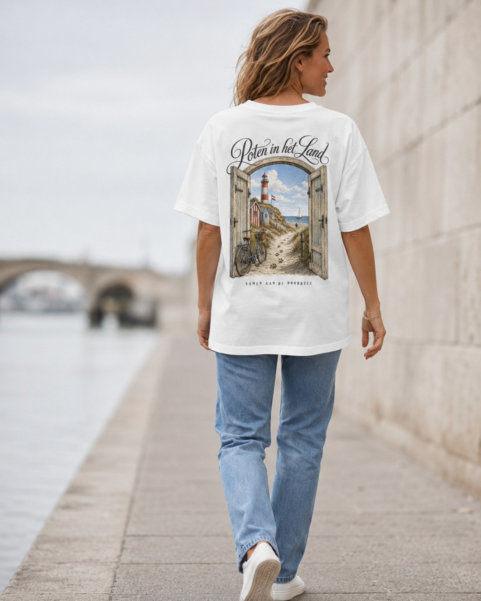 Woman wearing Poten in het Land white oversized t-shirt, back view